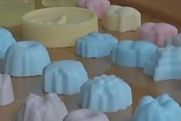 Fashion designer presents new collection inspired by traditional textiles