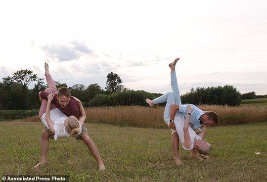 A local fire department rescued three people from a burning building early this morning, with no serious injuries reported.